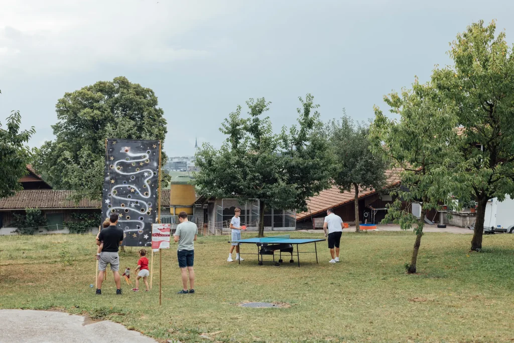 A ping-pong table and a “pulling game” on a meadow.